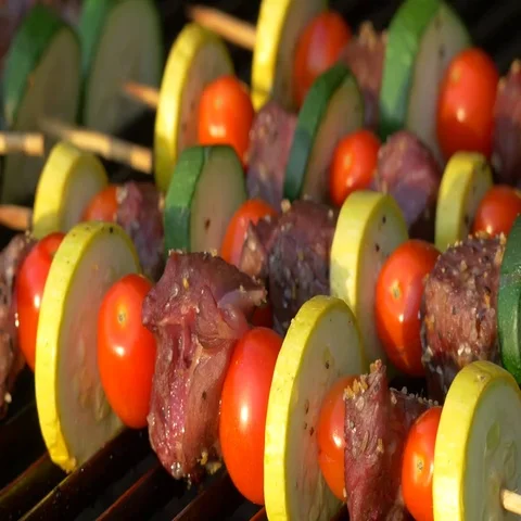 Person Rotating Kabobs on Grill, 4K Stock Footage 69467209