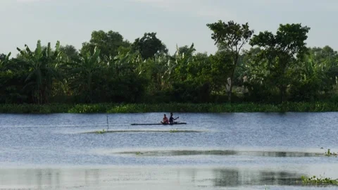 Person rowing a small boat Stock Footage 320005662