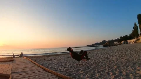 Person running on the beach at sunset Stock Footage 163532164