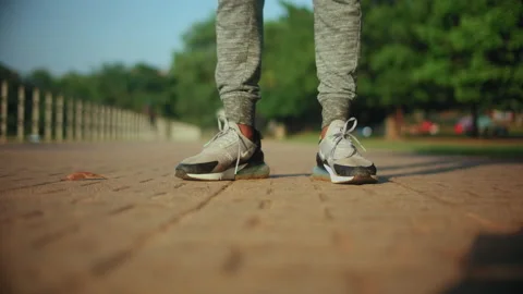 A person running in Nike shoes Stock Footage