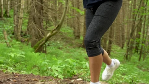 Person Running Up Steps in Green Forest Stock Footage 314005999