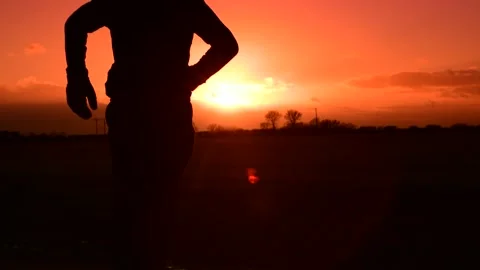 Person running at sunset Stock Footage 169717688