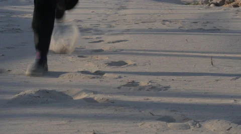 Person Running Through Sand and Dirt Stock Footage 60631667