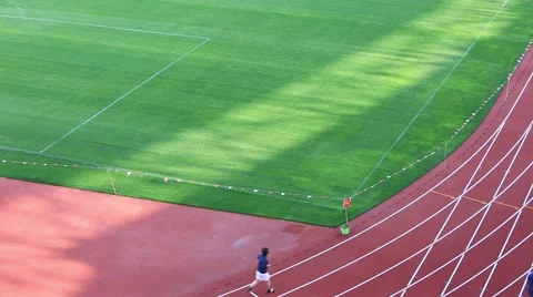 Person running on track Stock Footage 49938056