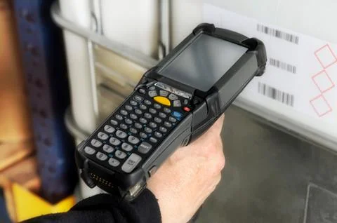 Person scanning a barcode with a scanner Stock Photos
