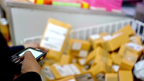 A person scanning item package to delivery service for sending and transfers 動画素材 334644570