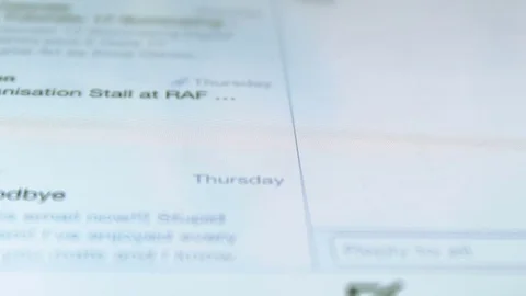 Person scanning a list of emails using a touchscreen portable device Stock Footage 72231382