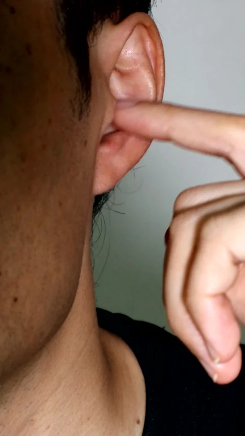 A person scratching inside their ear Stock Footage 334641577