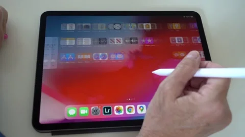 A person scrolling through Apps on an Apple iPad. Stock Footage 131561706