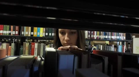 Person seaching for library book Stock Footage 46947761