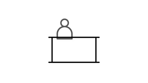 A person seated at a desk, focused on a computer screen, with a notepad and.. Stock Footage 332986391