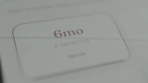 Person selecting a 6 month milestone Stock Footage 332492201