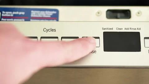 Person selecting rinse cycle on dishwasher control panel Vídeo Stock 329068016