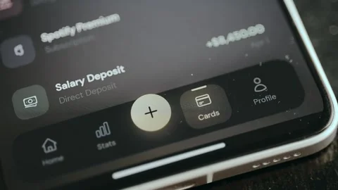 Person selects the Card menu option from the banking application Stock Footage 332499990