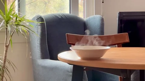 Person serving hot and steaming soup from a pot Video stock 222611600