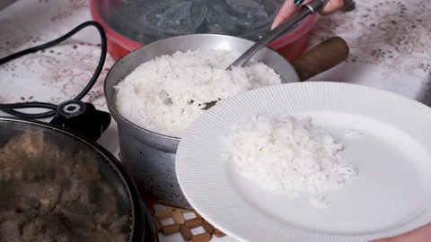 Person serving rice Stock Footage 281657316