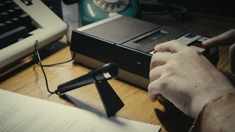 Person sets up Desktop microphone for retro cassette tape recording Stock Footage 308630159