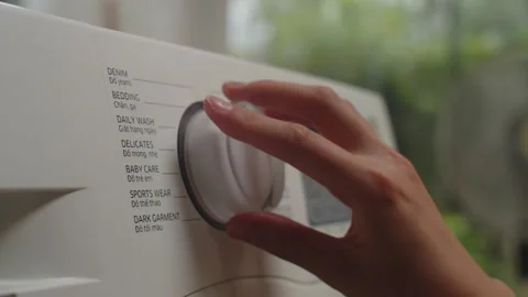 Person Setting Cycle of Washing Machine Stock Footage 266091994