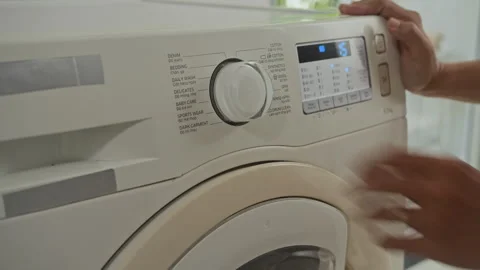 Person Setting Cycle of Washing Machine at Home Stock Footage 288177334