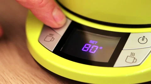 Person setting electric tea kettle temperature to 80 C (170F) Video stock 63793188