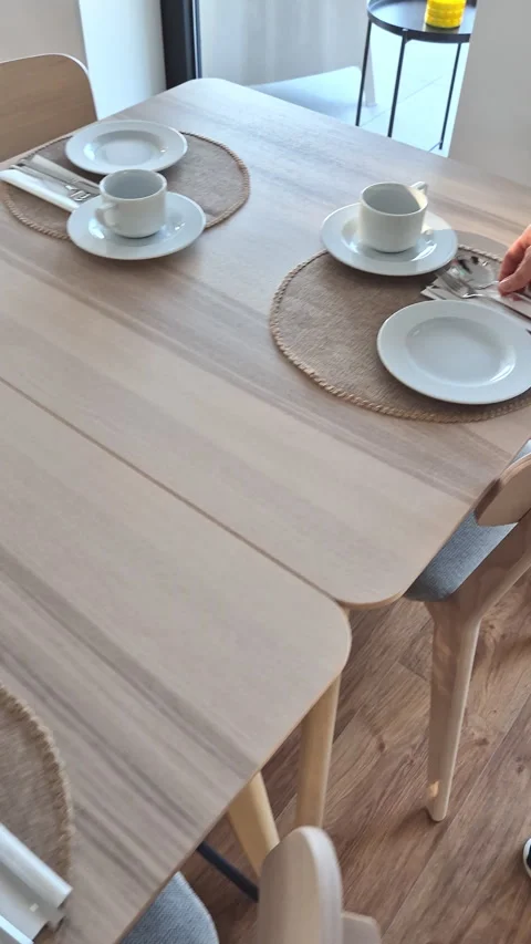Person Setting an Elegant Breakfast Table with Care Stock Footage 346178070
