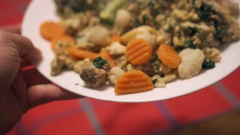 Person setting food on table in slow motion. Shallow depth of field. Video stock 101116116