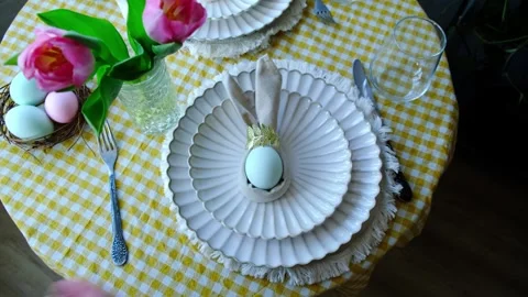Person setting table for Easter Stock Footage 332701427