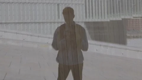 Person Shadow Reflection with Oslo Opera House and Deichman Library Stock Footage 340960546