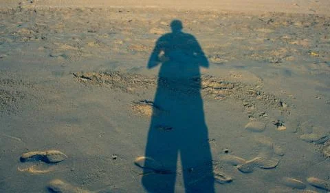 Person shadows with reflection on the ground Stock Photos
