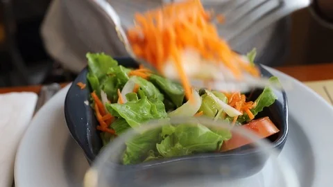 Person share salad from dish Video stock 114613271