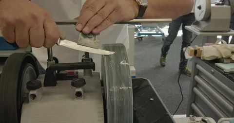 Person Sharpens Knife on Stone Stock Footage 211812854