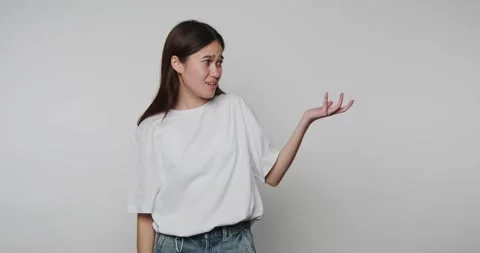 Person showing different hand gestures in a simple room while explaining a .. Stock-Footage 328248491