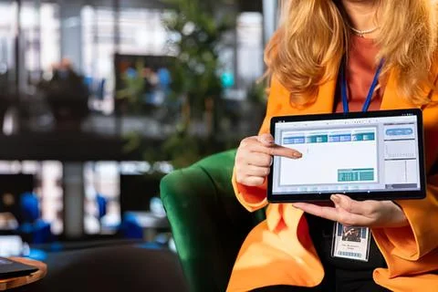 Person showing tablet with data analytics dashboard Stock Photos