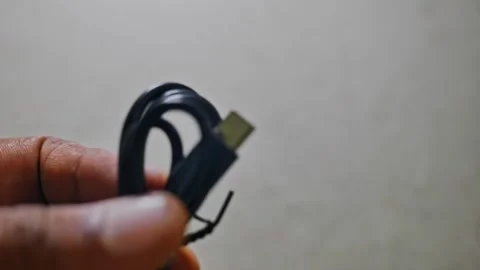 Person showing USB type-A to type-C  cable 4k short Stock Footage 289400479