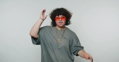 Person shows different expressions while wearing sunglasses and changing po.. Stock-Footage 331990812