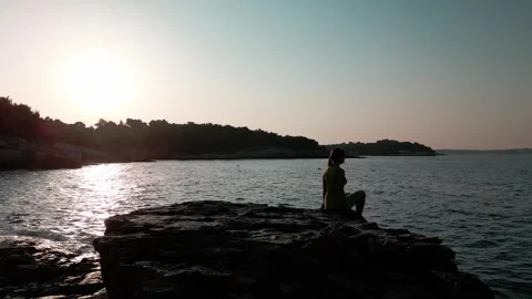Person sitting on the beach Stock Footage 249624979