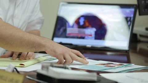 A person sitting at a desk Stock Footage 155537105