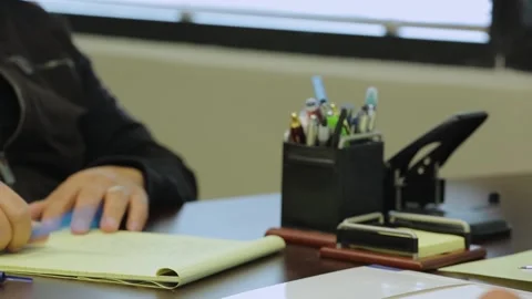 A person sitting at a desk using a computer Stock Footage 155532995