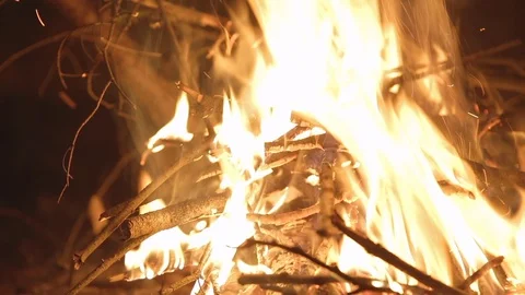 A person sitting next to a camp fire Video stock 101066867