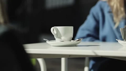 A person sitting at a table with a cup of coffee Video stock 155455673