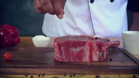 A person sitting at a table in front of a cake 库存影片 157873547