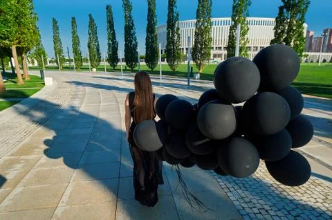 A person sitting on a table Stock Photos