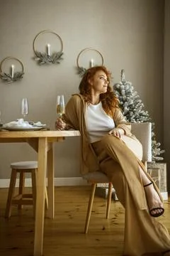 A person sitting on a table Stock Photos