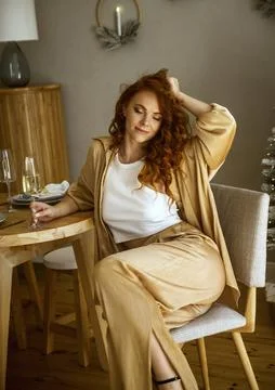 A person sitting on a table Stock Photos