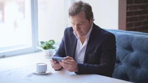 A person sitting at a table using a laptop Stock Footage 130042929
