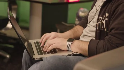 A person sitting at a table using a laptop computer Stock Footage 155536775