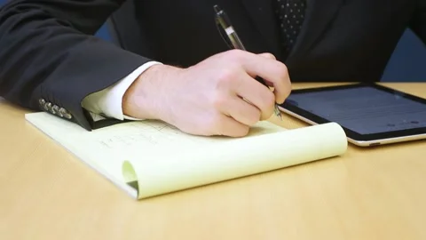 A person sitting at a table using a laptop Stock Footage 155537929