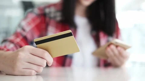 A person sitting at a table using a laptop 库存影片 156845254