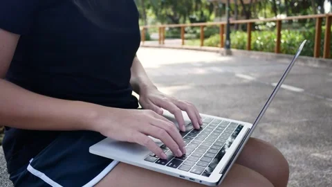 A person sitting at a table using a laptop computer 스톡 동영상 157866743