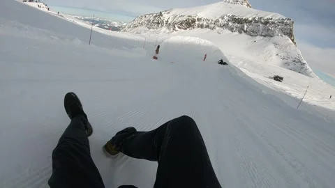 A person is skiing down a snow-covered slope Stock Footage 314516692